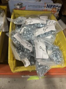 Bags of screws in Uline bags with barcodes
